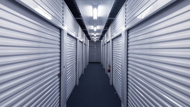 Outdoor self storage facility with blue roll-up doors